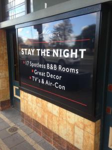 a sign on a building that says stay the night at Hotel Cessnock in Cessnock