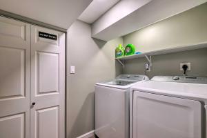 a small laundry room with a washer and dryer at Capitol Heights Home about 5 Mi to National Mall! in Capitol Heights +18 photos