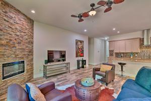a living room with a couch and a fireplace at Newly Constructed Mansfield Home with Fenced Yard! in Mansfield