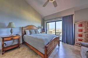 a bedroom with a bed and a window with a view at Resort-Style Cabo Getaway with Pools & Ocean Views in Cabo San Lucas +32 photos