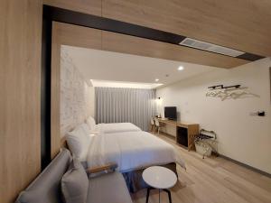 Una cama o camas en una habitación de 麗詩旅海景民宿