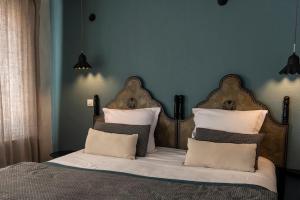 Hotel Spa Azteca Barcelonnette房間的床