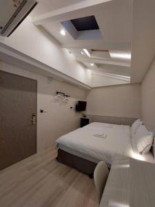 Una cama o camas en una habitación de 麗詩旅海景民宿