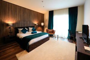 Postel nebo postele na pokoji v ubytování Premium Park Hotel