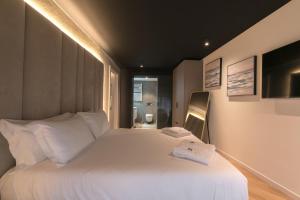 Posteľ alebo postele v izbe v ubytovaní Brera Luxury Apartment near Duomo With Wifi