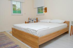 Łóżko lub łóżka w pokoju w obiekcie Kleva Houses