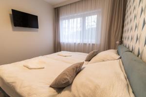 Postel nebo postele na pokoji v ubytování Thermal Lux Weninger Apartman