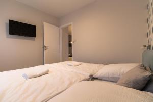 Postel nebo postele na pokoji v ubytování Thermal Lux Weninger Apartman
