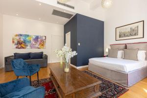 A bed or beds in a room at Suite della Pigna