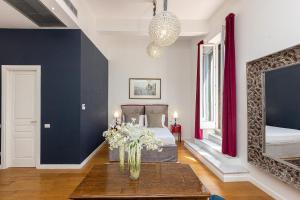 A bed or beds in a room at Suite della Pigna