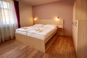 Apartmány Tatra客房内的一张或多张床位