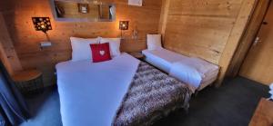 Postel nebo postele na pokoji v ubytování Hôtel Spa L'Oxygène