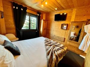 Postel nebo postele na pokoji v ubytování Hôtel Spa L'Oxygène