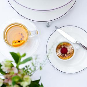 a table with a cup of tea and a plate of food at Ice House Hotel in Ballina