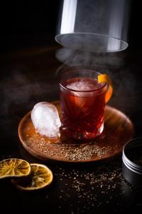 a cup of tea on a plate with a drink at Ice House Hotel in Ballina