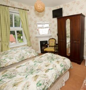 Postel nebo postele na pokoji v ubytování Gleneven Guest House