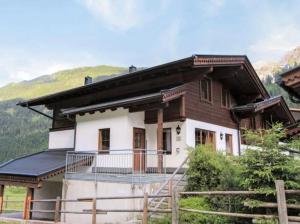 a house in the mountains with a balcony at Alois & Elisabeth, Chalet in Tux