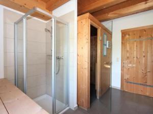 a shower with a glass door in a bathroom at Alois & Elisabeth, Chalet in Tux