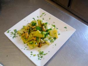 a white plate of food on a table at Frontemare Hotel Village & Ristorante in Rodi Garganico