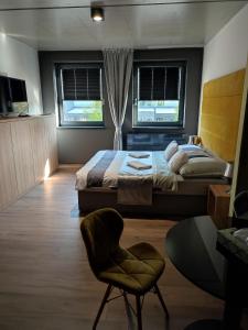 Posteľ alebo postele v izbe v ubytovaní OPÁL Residence Apartman