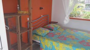 Postel nebo postele na pokoji v ubytování ti case gwada location