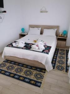 Posteľ alebo postele v izbe v ubytovaní Crystal Blue Apartments + 37 fotografií