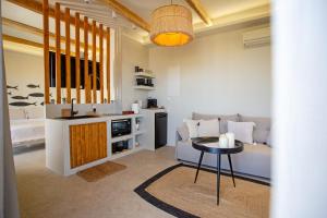 a living room with a table and a couch at Ocean Pearl Luxurious Suite in Pachaina