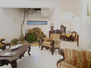 a living room filled with furniture and a table at Elegance Oasis, Colombo 3 in Colombo
