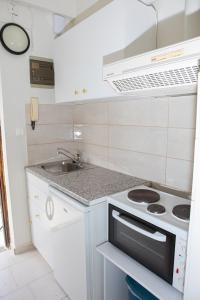 Kuchyň nebo kuchyňský kout v ubytování Ronzi Apartments