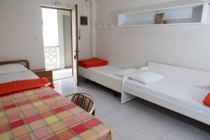 Postel nebo postele na pokoji v ubytování Ronzi Apartments