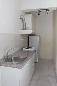 Kuchyň nebo kuchyňský kout v ubytování Ronzi Apartments