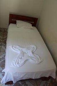 Säng eller sängar i ett rum på Tengana Hospedaje y Tours