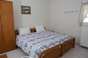 Postel nebo postele na pokoji v ubytování Ronzi Apartments