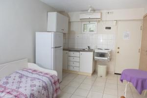 Kuchyň nebo kuchyňský kout v ubytování Ronzi Apartments