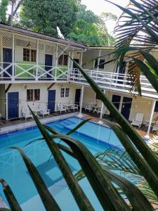 a view of the house and the swimming pool at Lizard King Hotel & Suites in Puerto Viejo