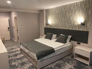 Postel nebo postele na pokoji v ubytování Yeşilyurt Park Otel