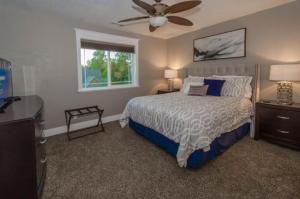 a bedroom with a bed and a ceiling fan at Separation Canyon Retreat in Flagstaff