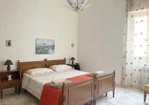 Llit o llits en una habitació de OLTREMARE casa per vacanze con terrazzo