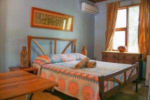 Voodi või voodid majutusasutuse Hotel Boruca Tamarindo toas