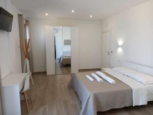 Letto o letti in una camera di AMARE Bed & Breakfast