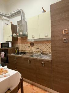 A kitchen or kitchenette at A Casa di Anna - Apartment