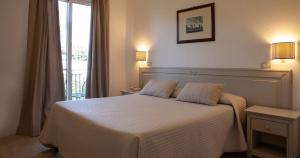 Postel nebo postele na pokoji v ubytování Parkhotel Montigeto