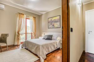 Łóżko lub łóżka w pokoju w obiekcie Hotel Villa De Santis