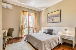 Łóżko lub łóżka w pokoju w obiekcie Hotel Villa De Santis