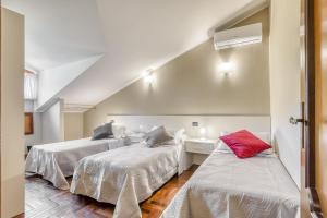 Łóżko lub łóżka w pokoju w obiekcie Hotel Villa De Santis