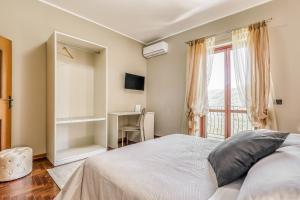 Łóżko lub łóżka w pokoju w obiekcie Hotel Villa De Santis