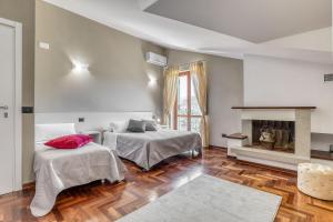 Łóżko lub łóżka w pokoju w obiekcie Hotel Villa De Santis