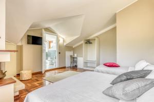 Łóżko lub łóżka w pokoju w obiekcie Hotel Villa De Santis