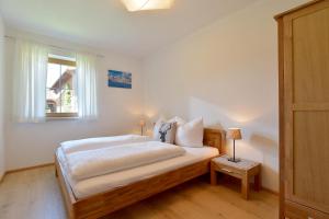 Posteľ alebo postele v izbe v ubytovaní Ferienwohnung am Lindenweg