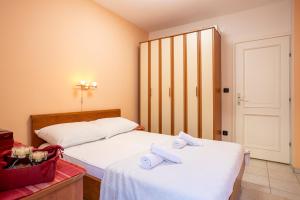 Posteľ alebo postele v izbe v ubytovaní Apartment EVALA